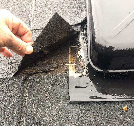 Uncovering damaged flashing during roof repair in Pleasanton
