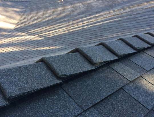 Ridge cap replacement by a roofer in Atwater, California