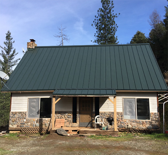 ASC Skyline standing seam roof installation in forest green