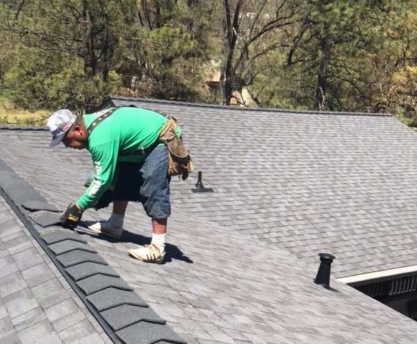 one of our roofers in Manteca is adding new shingles