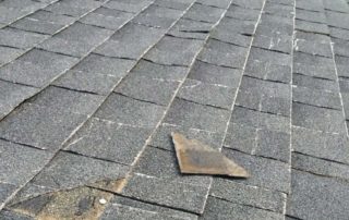 missing shingles are a sign for needing a roof replacement