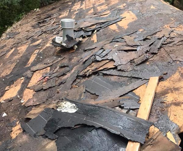 broken shingles are a sign for an emergency roof repair