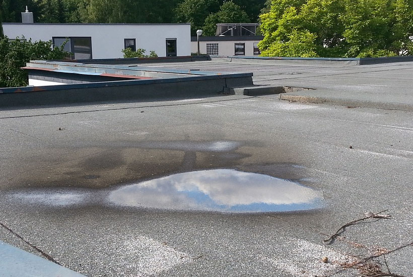 What to Do About water ponding on a flat roof?